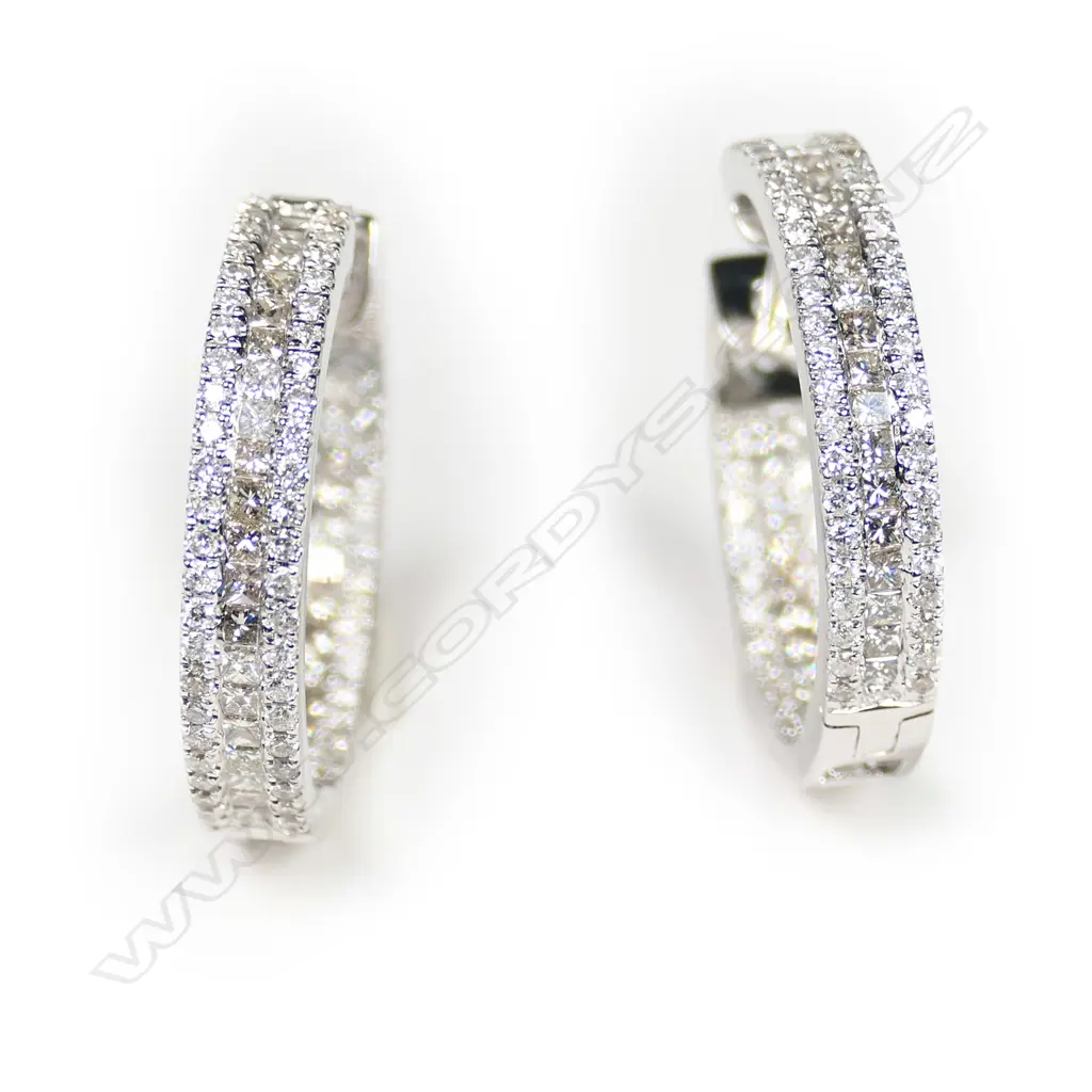 A pair of 18ct white gold and diamond earrings, Image 1++