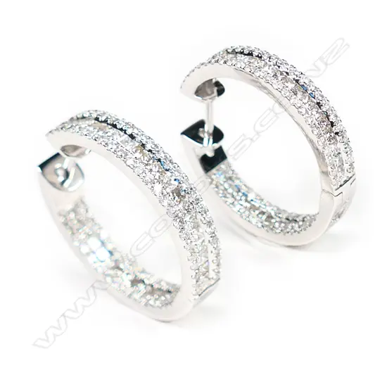 A pair of 18ct white gold and diamond earrings,