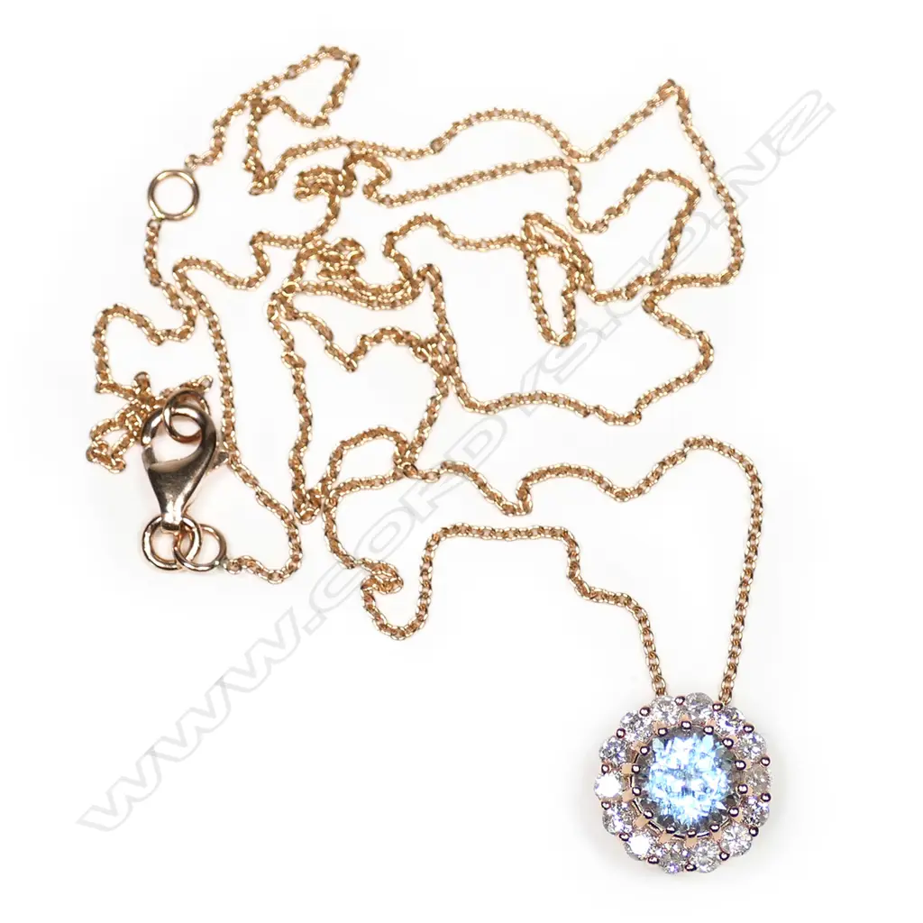 A 14ct rose gold aquamarine and diamond halo necklace, Image 1++