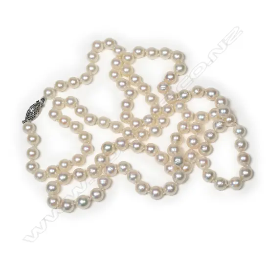 A long, single strand necklace of 108 cultured pearls with gold clasp,