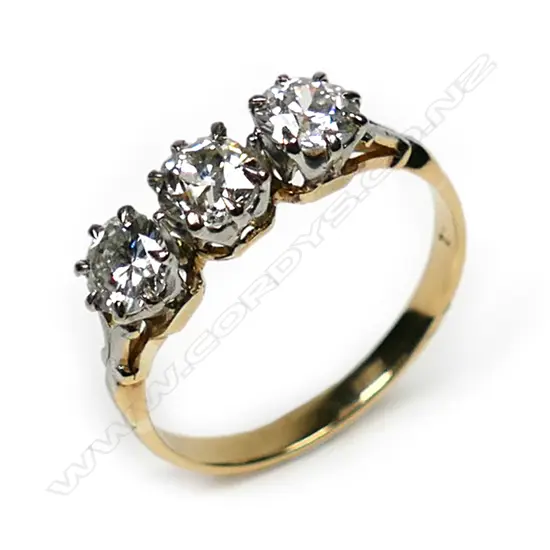 An estate 18ct gold three stone diamond ring,