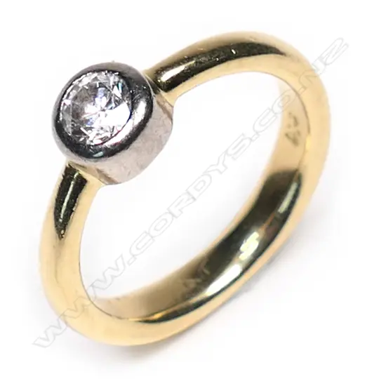 An 18ct gold and diamond solitaire ring,