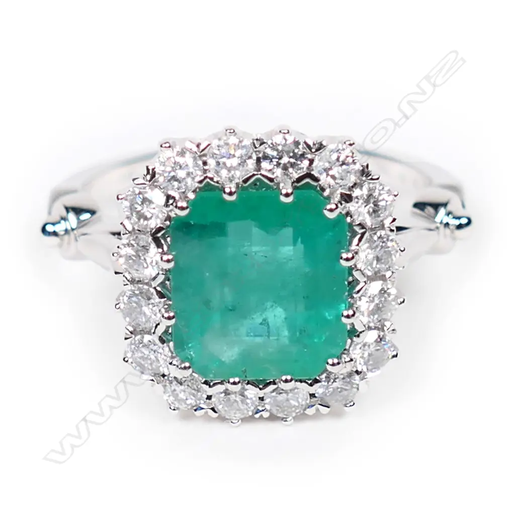 A 14ct white gold, emerald and diamond antique style halo ring, Image 1++