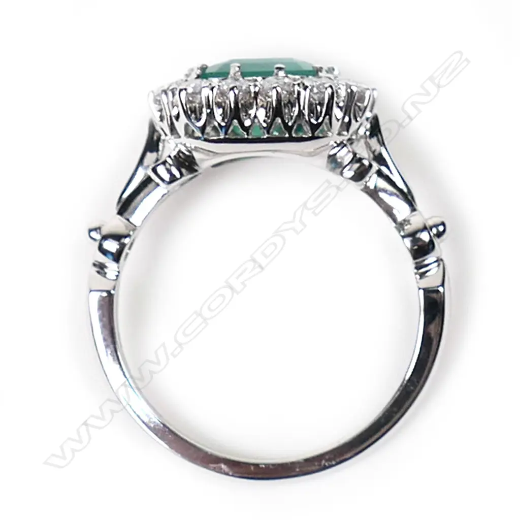 A 14ct white gold, emerald and diamond antique style halo ring, Image 1++