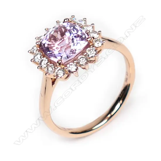 A 14ct rose gold, kunzite and diamond halo ring,