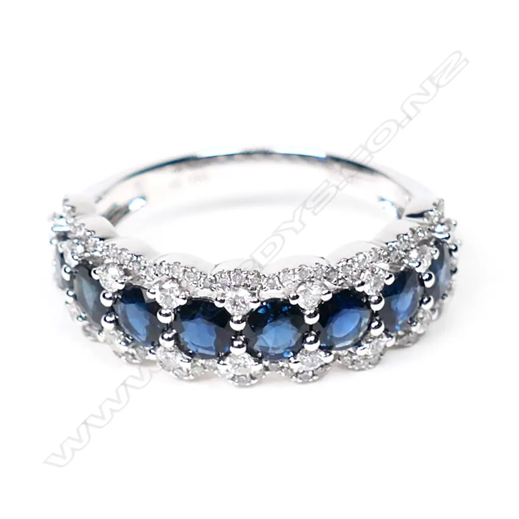 A 14ct white gold, sapphire and diamond halo eternity style ring, Image 1++