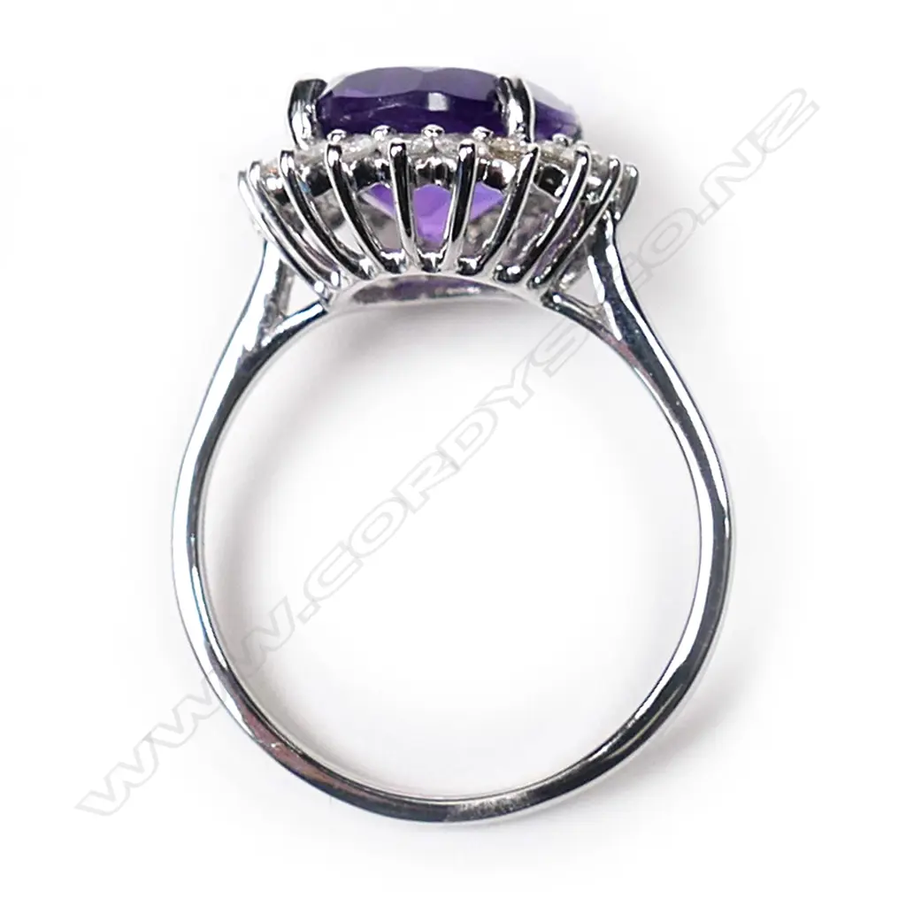 A 14ct white gold, amethyst and diamond halo ring, Image 1++