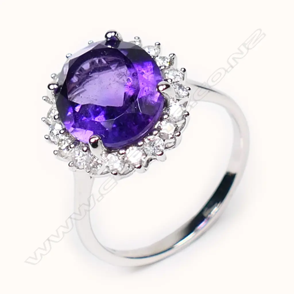 A 14ct white gold, amethyst and diamond halo ring, Image 1++