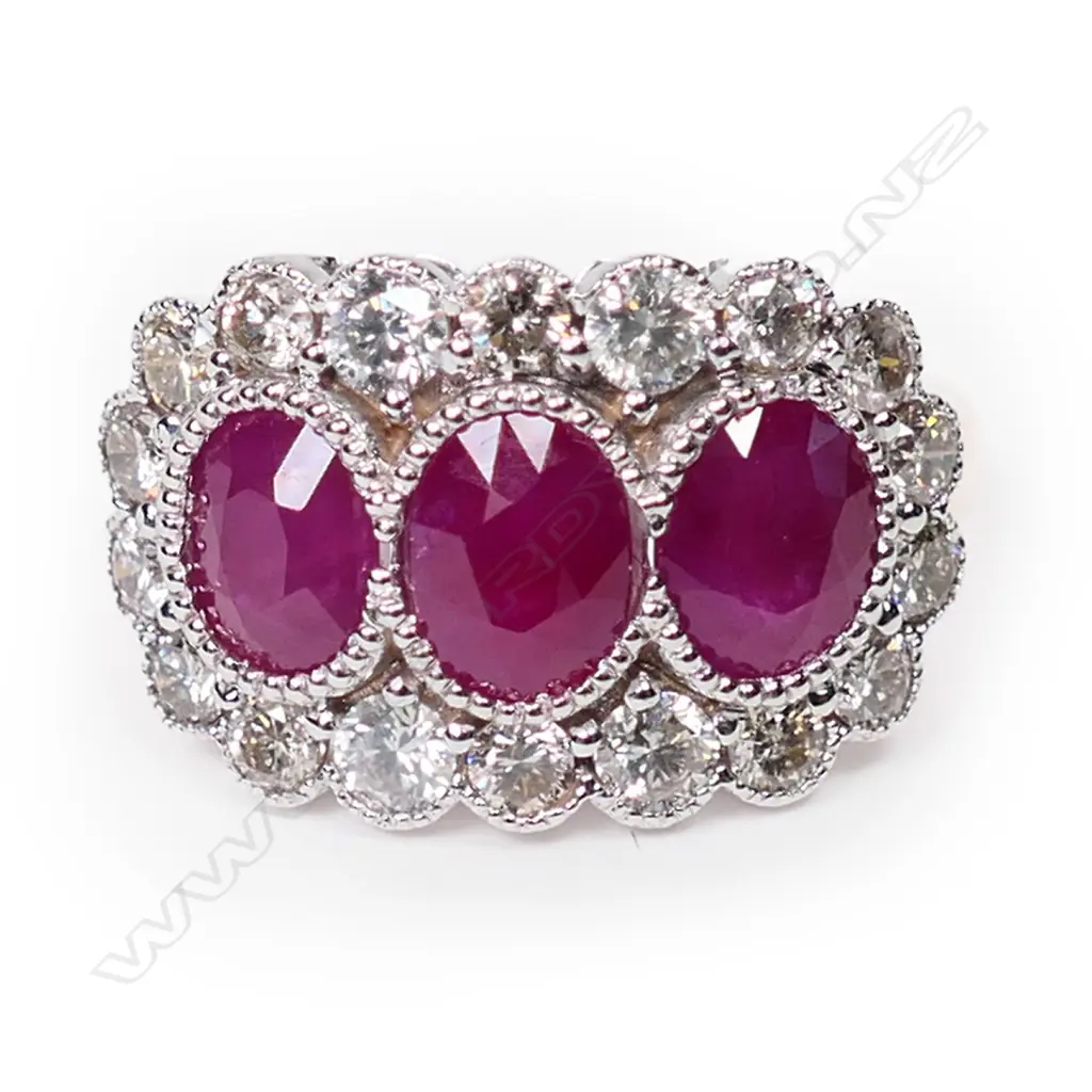 A 14ct rose gold, ruby and diamond trilogy ring, Image 1++