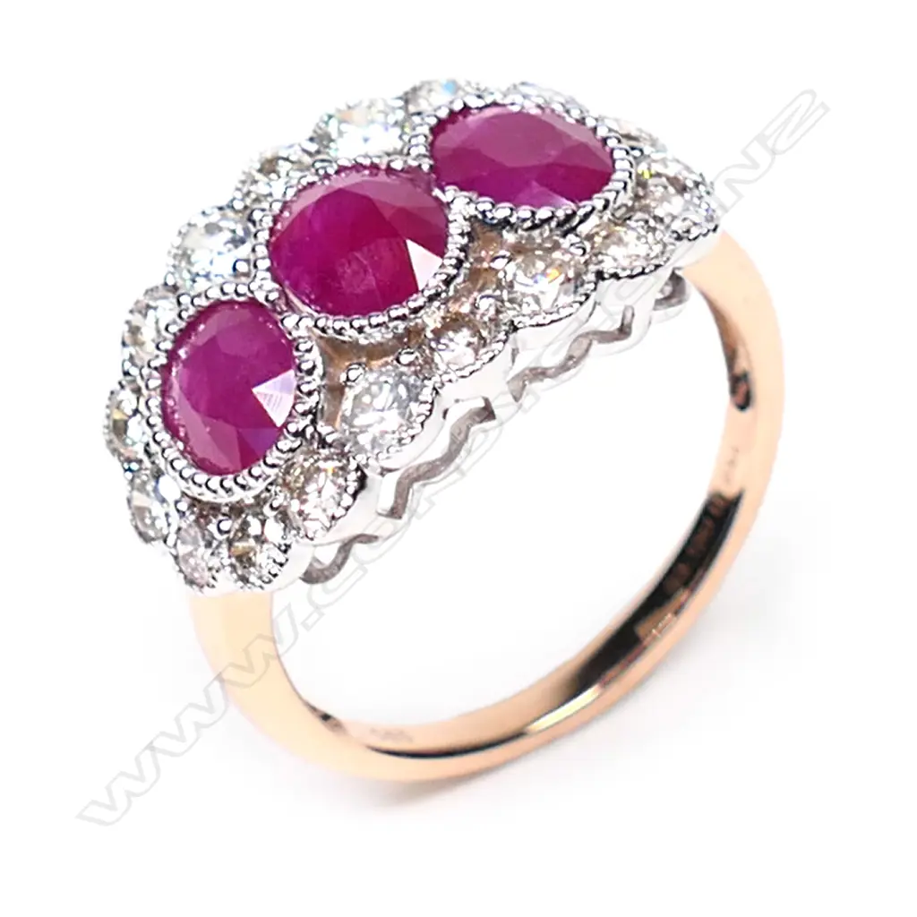 A 14ct rose gold, ruby and diamond trilogy ring, Image 1++