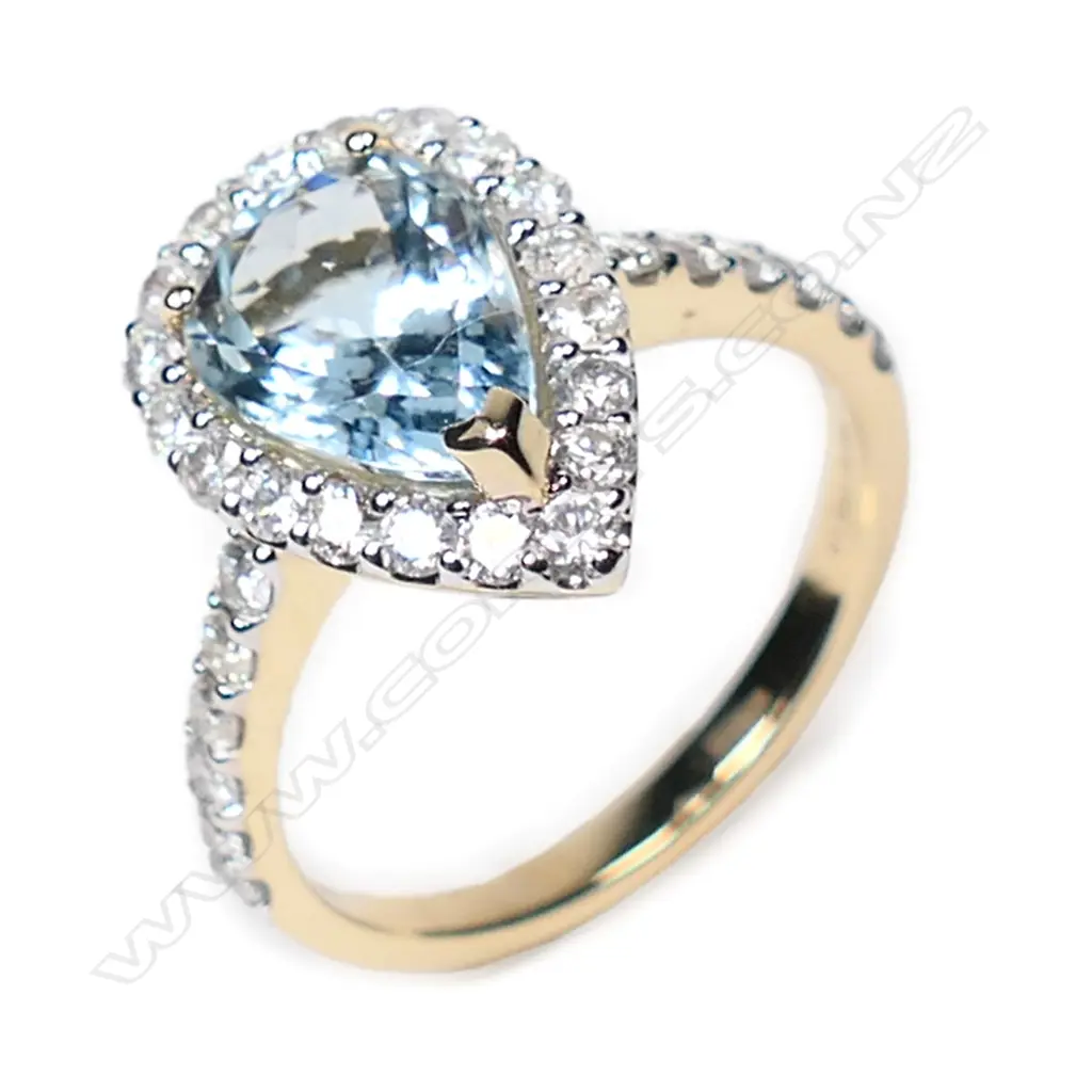 A 14ct gold, aquamarine and diamond halo ring, Image 1++