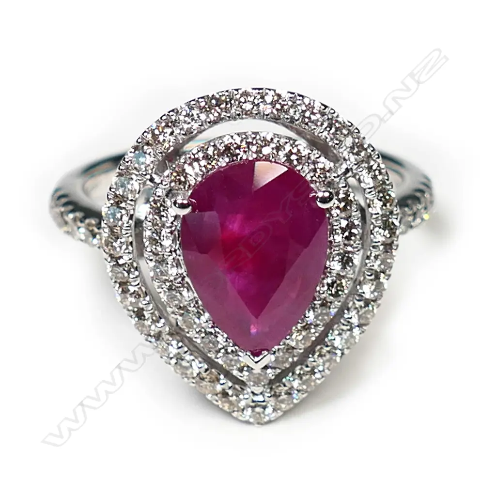 A 14ct white gold ruby and diamond double halo ring, Image 1++