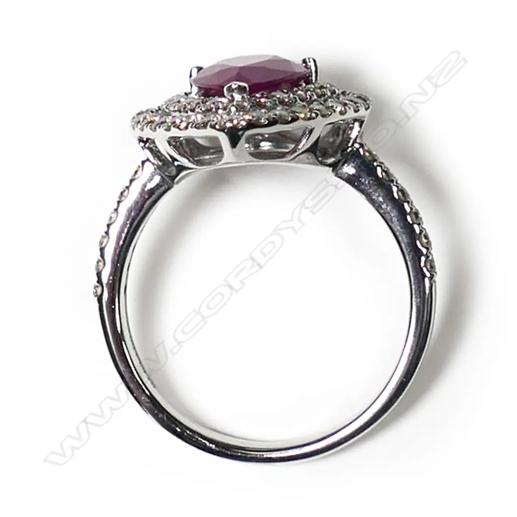 A 14ct white gold ruby and diamond double halo ring, Image 1++