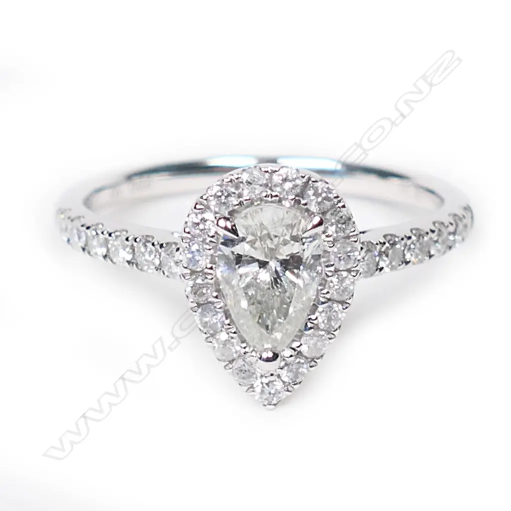 A 14ct white gold and diamond halo ring, Image 1++
