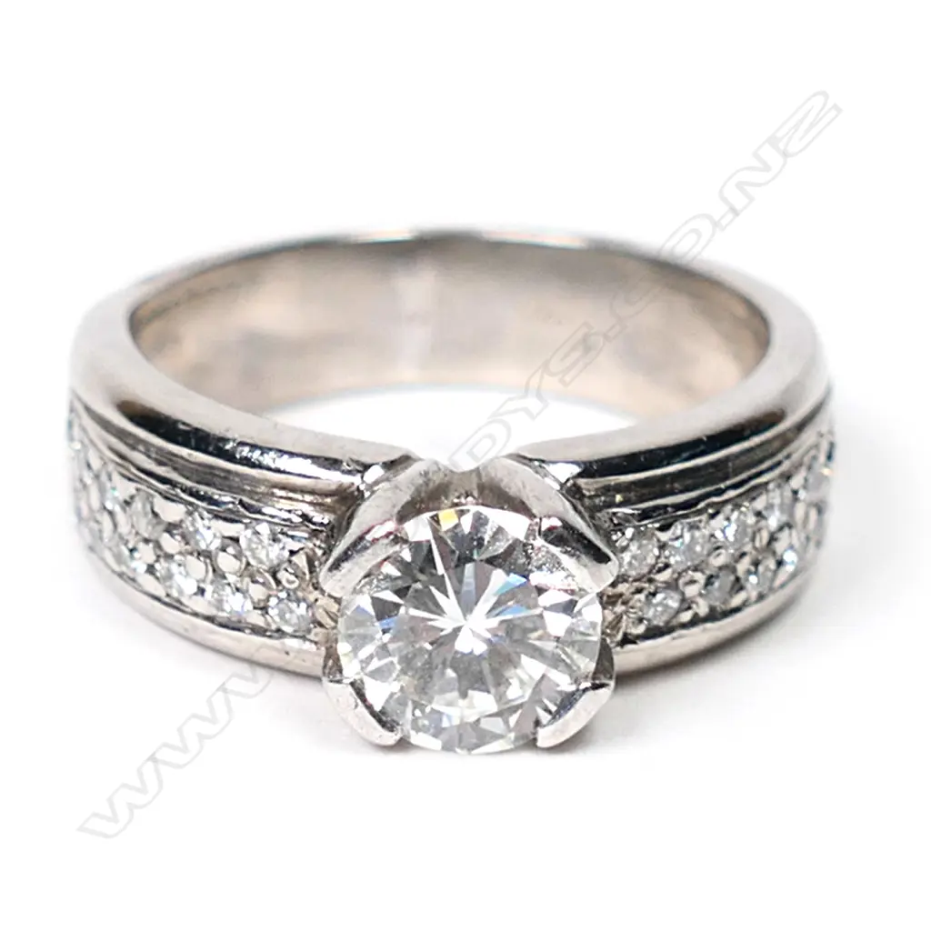 An 18ct white gold and solitaire diamond ring, Image 1++