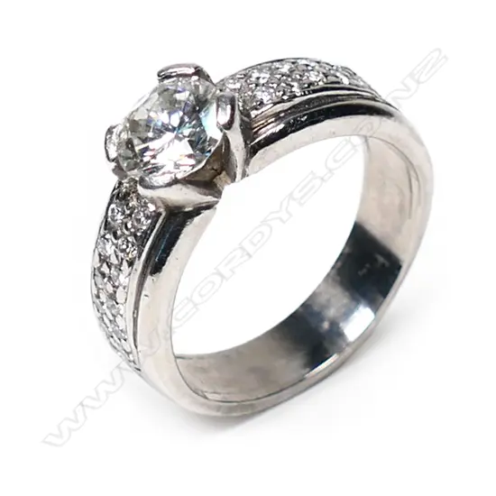An 18ct white gold and solitaire diamond ring,