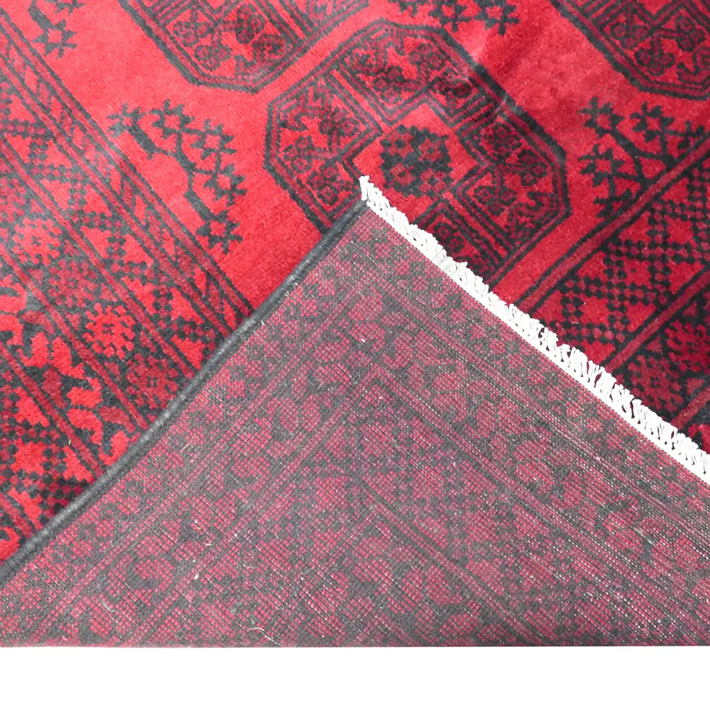 A large hand knotted Turkman 'elephant's foot' pattern carpet Image 1++