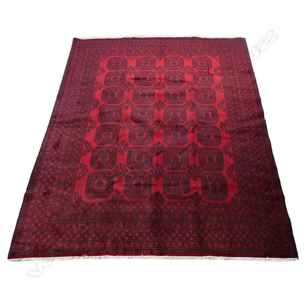 A large hand knotted Turkman 'elephant's foot' pattern carpet Image 1++