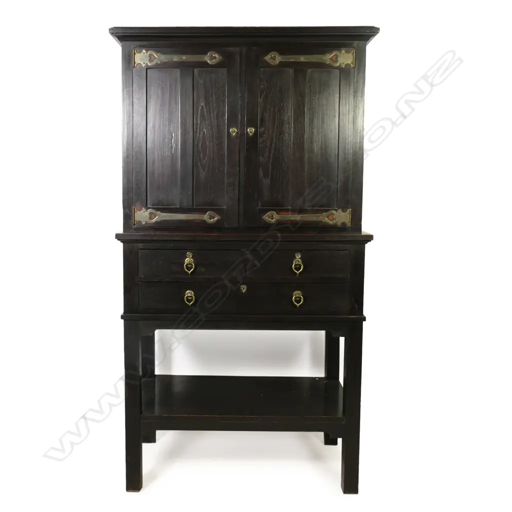 An Edwardian Arts & Crafts ebonized oak cabinet on stand Image 1++
