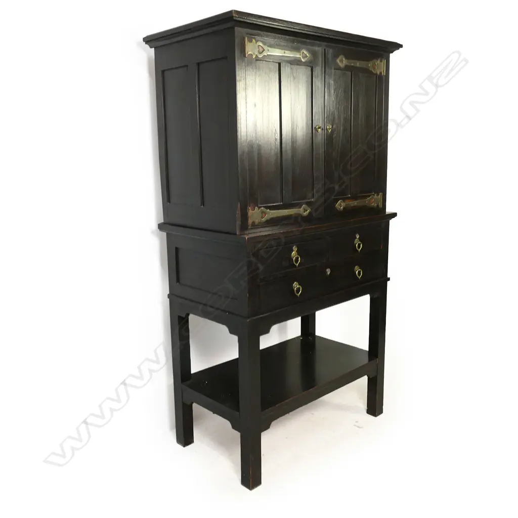 An Edwardian Arts & Crafts ebonized oak cabinet on stand Image 1++