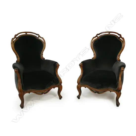 A pair of quality rosewood framed armchairs in the French style,