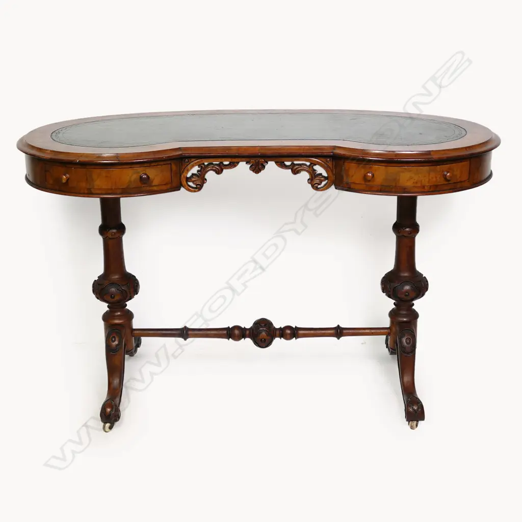 A Victorian tooled leather topped lady's desk of kidney shape Image 1++