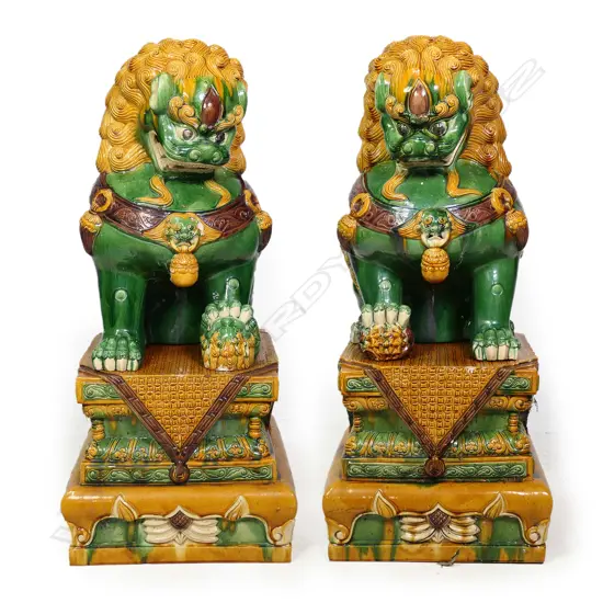 A pair of massive Oriental ceramic temple lions,