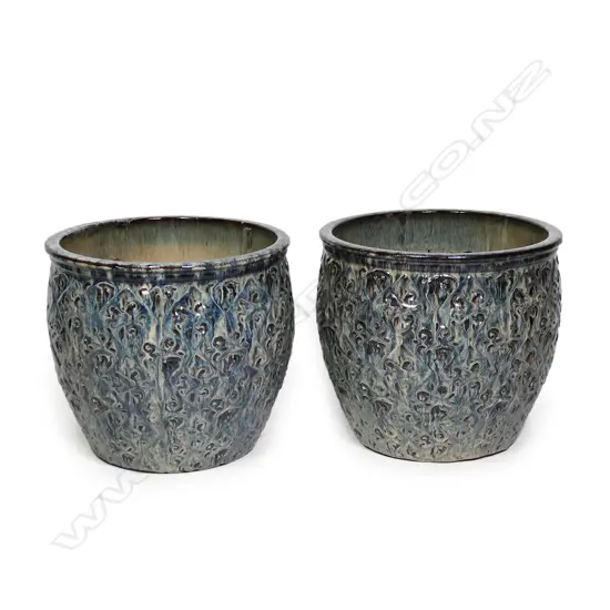 A pair of mottled blue-green glazed ceramic garden pots,