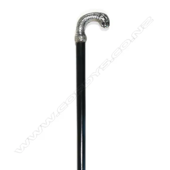 An ebony walking stick with silver leopard's head handle,