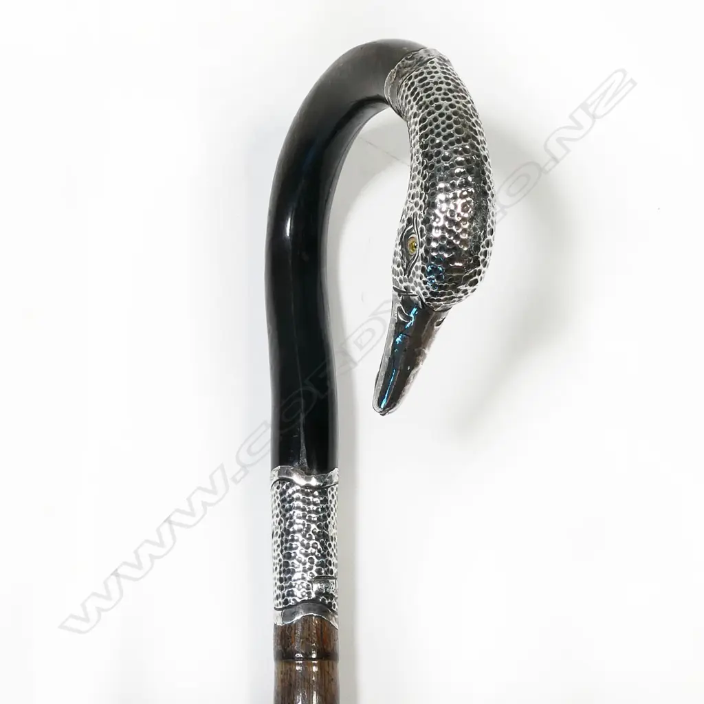 A lady's walking cane, with silver swan's head handle Image 1++