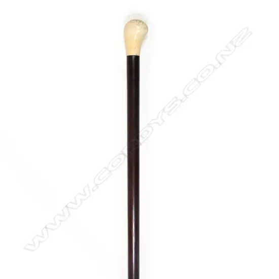 An ebony walking stick with marine ivory handle