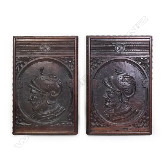 A pair of 19thC or earlier carved oak portrait panels,