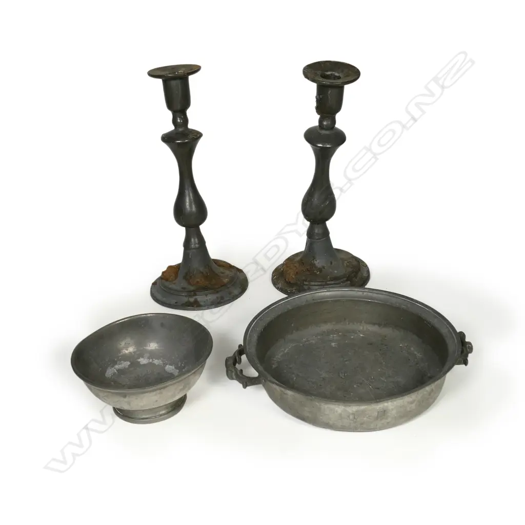 Four antique pewter pieces including a pair of baluster column candlesticks and two bowls of which one is handled. H.290mm Image 1++