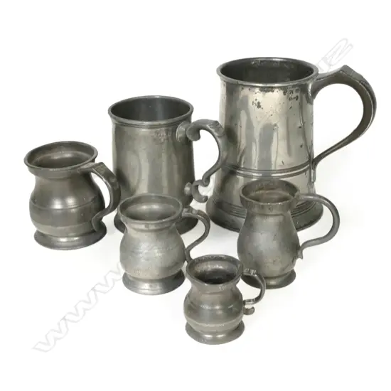 Six graduating antique pewter mugs,