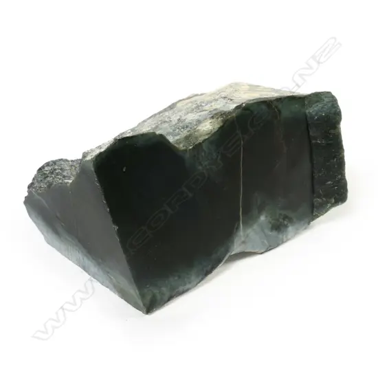 A large natural and cut block of nephrite pounamu,