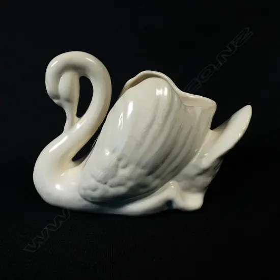 A small white Crown Lynn swan,