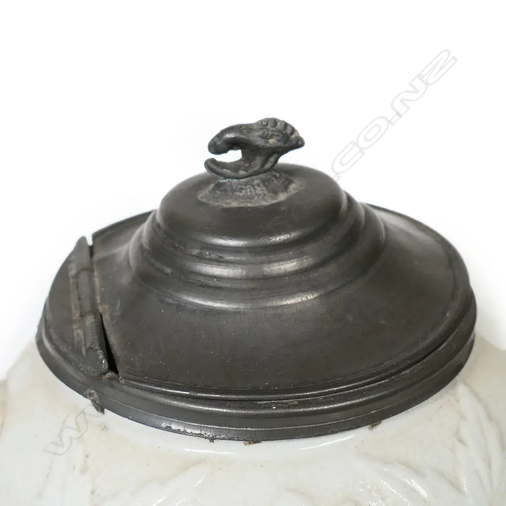 A salt glaze china Victorian period teapot, with pewter mounted cover and decorated with prunus and basket weave. Unmarked. W.230mm. Image 1++