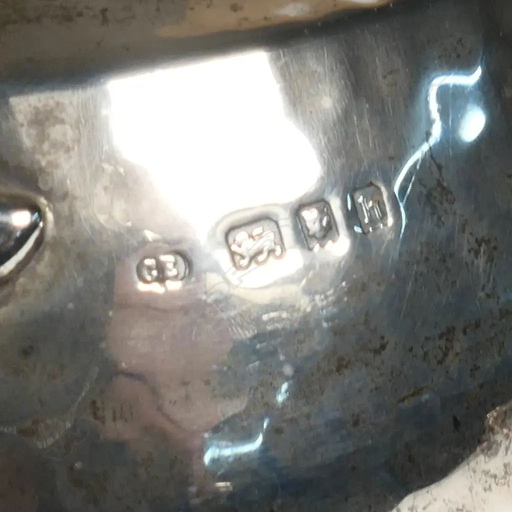 An Arts and Crafts silver three-piece tea set, London, 1923 by Charles Edwards Image 1++