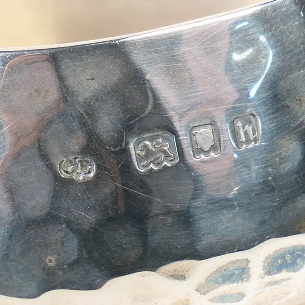 An Arts and Crafts silver three-piece tea set, London, 1923 by Charles Edwards Image 1++