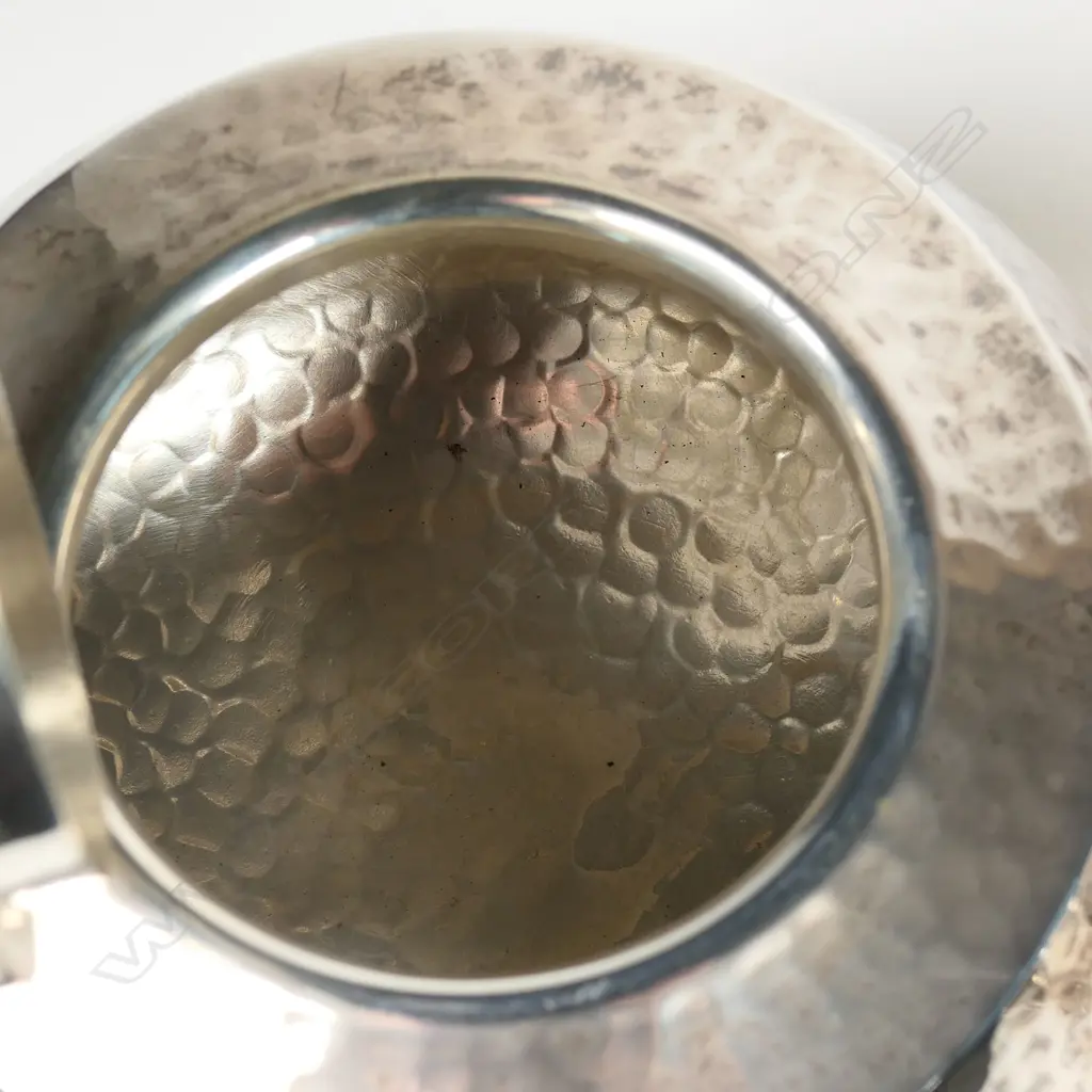 An Arts and Crafts silver three-piece tea set, London, 1923 by Charles Edwards Image 1++