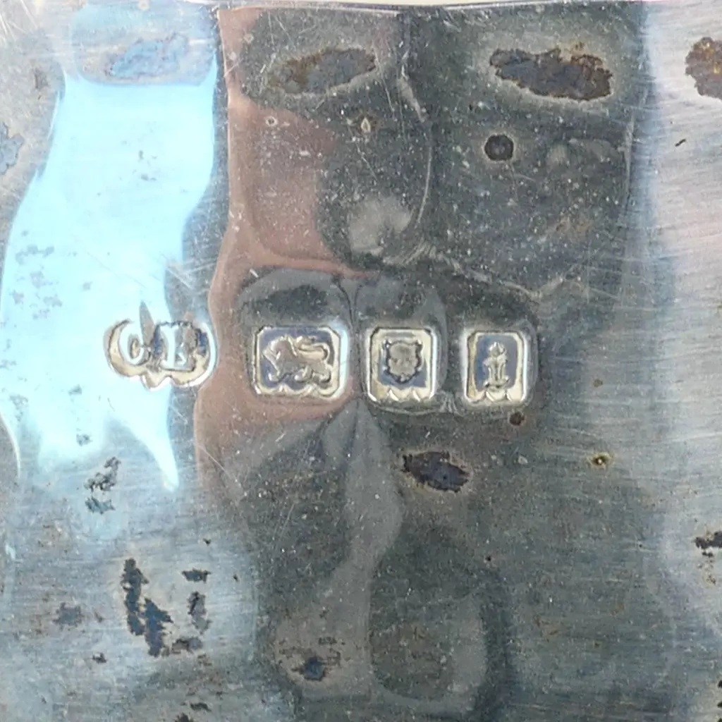 An Arts and Crafts silver three-piece tea set, London, 1923 by Charles Edwards Image 1++