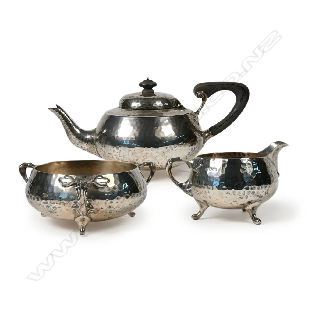 An Arts and Crafts silver three-piece tea set, London, 1923 by Charles Edwards Image 1++
