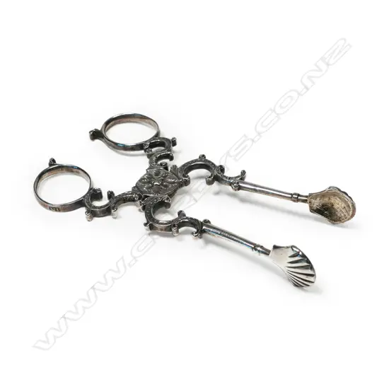 A pair of Irish silver sugar nips,