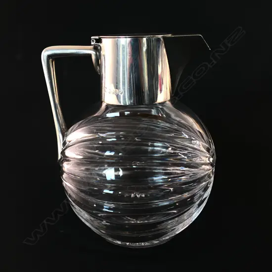 A Victorian silver and glass claret jug,