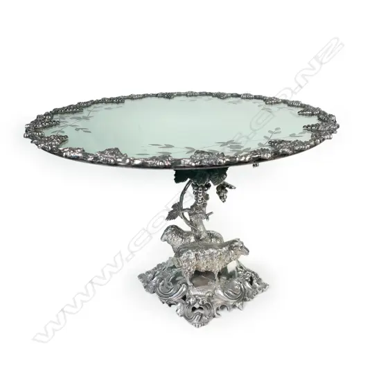 A silver-plated cake stand with mirrored plateau