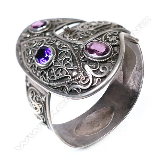 An early 20thC fancy silver hinged belt and buckle bangle,