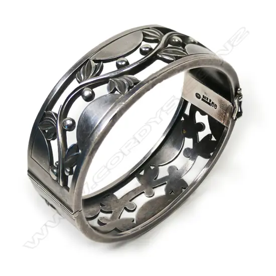 A vintage Georg Jensen solid silver Art Deco vine design hinged bangle,