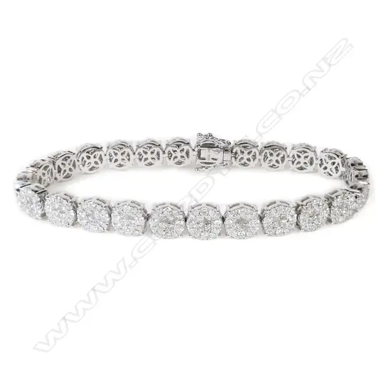 An 18ct white gold and multi cluster diamond bracelet,