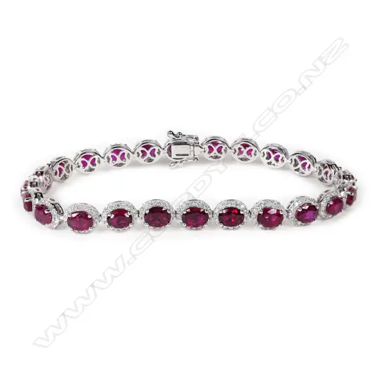 An impressive 18ct white gold and multi ruby and diamond cluster bracelet,