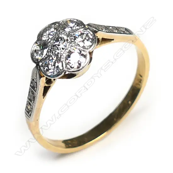A vintage 18ct gold and diamond cluster ring,